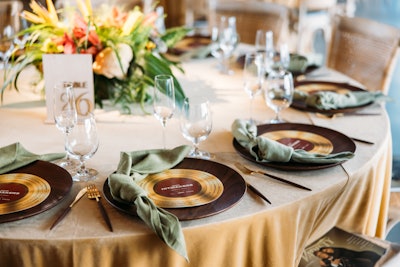 Place settings tied into the music theme by evoking gold records. 24 Carrots Catering handled food, while DJ Andrés Javier Uribe provided entertainment.
