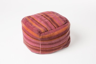 Yeah! Rentals’ striped pouf ($27.75 for four poufs per day) offers a more muted palette of the magenta hue.