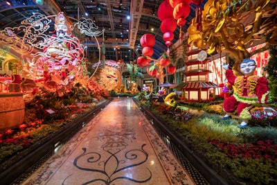 On the East Bed is a 17-foot-tall statue of Caishen, the Chinese god of wealth, who is perched on a trove of gold coins and surrounded by a family of eight golden rabbits. The North Bed, meanwhile, features five floral topiary children made of carnations and botanical accents.