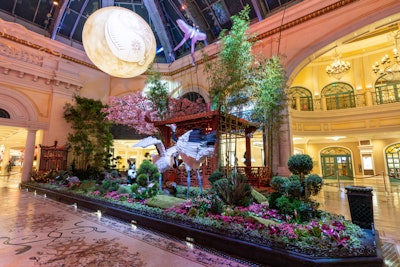 Finally, the Bellagio’s South Bed features a glowing moon, a cherry blossom tree, cranes, and pink lunar moths crafted from botanical materials, and another rabbit. Inside the on-site tea house is the Garden Table, an immersive dining space that is hosting dim sum lunch or dinner feasts for up to four guests at a time.