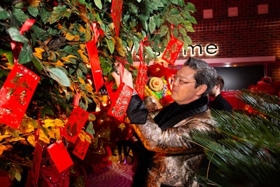 During the after-party, guests could pull envelopes from a tree; if their envelope had an '8' or '88' on it, they received a gift from event sponsor Piaget. Dessert carts served Chinese pastries and other treats inspired by the Year of the Pig. See more: This Lavish Chinese New Year Party Was Packed With Decor and Floral Inspiration