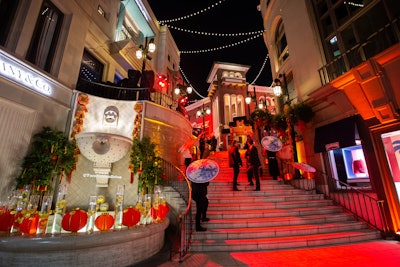 As guests climbed the stairs to Two Rodeo in Beverly Hills, they were greeted with champagne and lychee cocktails. At the top of the stairs, the event was marked with a re-creation of the entrance to Chinatown in Los Angeles, branded with the Chiu name.