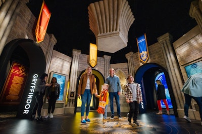 At the end of the Grand Staircase hallway, guests are met with the first part of the exhibit, where all four Hogwarts houses are honored with costume, photo, and text displays that offer insight into how and why the costumes played a huge role throughout all eight Harry Potter films. The area also marks the first place in the exhibit where guests can use their RFID wristband technology to earn points for their selected house by tapping their wristband on the designated sensor.