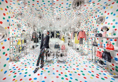 Robot of artist Yayoi Kusama in window of NY Louis Vuitton store