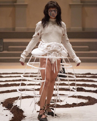 Zoe Gustavia Anna Whalen debuted her collection at St. Mark's Church in the Bowery with a performance-like show that featured a labyrinth made of soil, which the models walked around. Full-service firm Ojeras produced the show.