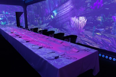 The Journey 360 experience features floor-to-ceiling projections that transport guests seated at a 20-person communal table to five different locations during each course of the prix-fixe meal.