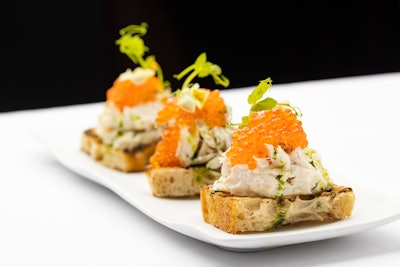 At the lounge, guests can order small bites like smoked sturgeon toast with trout roe.