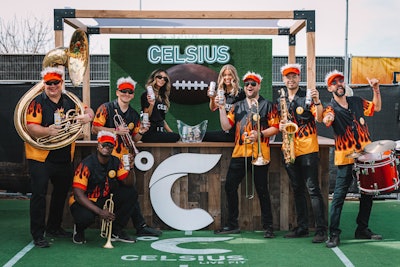 Elsewhere at the tailgate, CELSIUS had an on-theme activation outfitted in turf where brand representatives handed out the energy drink to attendees, including to band members who played at the event and dressed up as Fieri in his signature flame-clad button down, visor, and sunglasses. Richman also pointed to Sprouts Farmers’ Market activation as another standout, where there was “a custom-built butcher case [that] attendees could walk through and personally select their meat to have grilled right in front of them.”