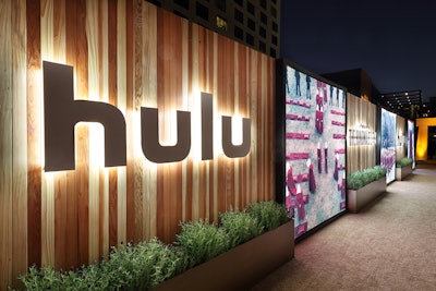 During the Emmys in 2017, Hulu hosted a viewing party and after-party designed and produced by 15/40. The event featured a step-and-repeat with wood plank walls and metal planters filled with lavender. Decor focused on The Handmaid’s Tale, the evening’s winner for Outstanding Drama Series; the Hulu and Handmaid’s Tale logos were back-lit and mounted onto the walls, and dramatic scenes from the show were displayed in custom eight-by-eight lightboxes. See more: Emmys 2017: Inside the Glitzy Gatherings From the Television Academy, HBO, Fox, and More