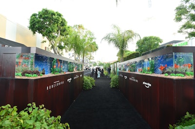 The premiere of Amazon’s Prime Video’s series Homecoming, starring Julia Roberts, took place in 2018 in Los Angeles. For the arrivals area, Swisher Productions and 15/40 incorporated live fish tanks—branded with Prime Video logos to make a sort-of pseudo-step-and-repeat—to evoke the main character’s office. The carpet also featured a live palm wall, a reference to the show’s Florida setting.