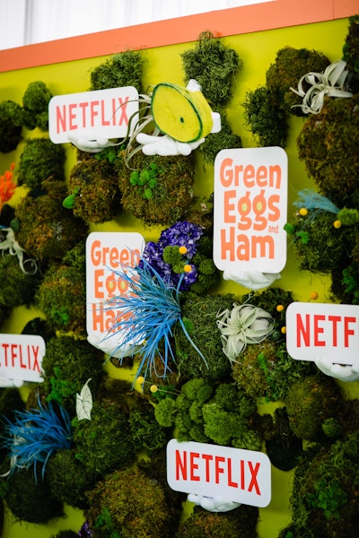 For Netflix's Green Eggs & Ham premiere in 2019, Netflix tapped event production company ROCK+PAPER to create an outdoor, family friendly experience inspired by the series' setting of Meepville. Series stars, including Diane Keaton, Ilana Glazer, Adam Devine, and Keegan-Michael Key, walked the green carpet, which featured mechanical arms holding skillets and plates of—what else?—green eggs and ham.