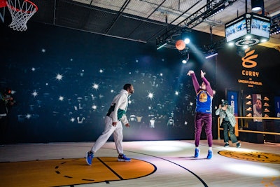 There was a photo op where fans could recreate Steph Curry’s famous buzzer-beating shot in the game against Oklahoma City, and a pop-up locker room was filled with custom branded lockers honoring UA Basketball athletes.