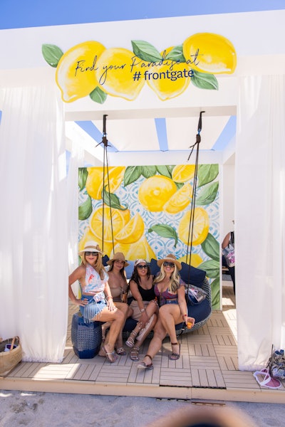 Outdoor furniture supplier Frontgate hosted a framed, swinging cabana. The spot was great for photos thanks to a lemon-clad backdrop and tasteful (no pun intended) branded moments.