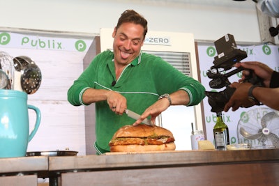 Fresh off the pickleball court, an enthusiastic Jeff Mauro assembled “The Ultimate Cheesy Chicken Parmesan Muffuletta” for his Publix cooking demo at the Saturday Grand Tasting.