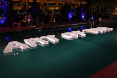 To make an even bigger splash, massive 'Art of Tiki' event signage floated in the pool at Kimpton Surfcomber Hotel.