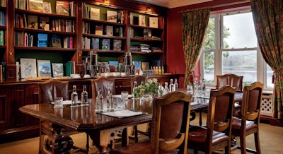Sheen Falls Lodge's cozy library is ideal for an intimate dinner for up to 14 people.