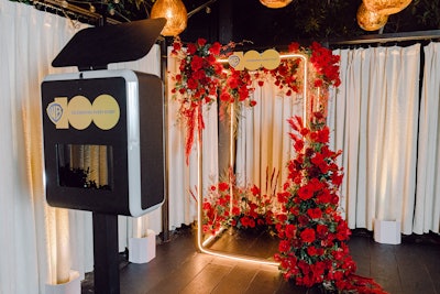 An LED cube by iTouchBooth offered a flower-covered photo op.