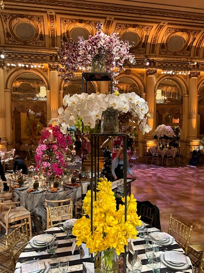 “We wanted the overall design to be minimal, so each element had room to breathe and to be seen,” Crary said. “We chose to design the table elements in black and white so the colorful orchids could pop.” The florals were paired with the Black Awning Stripe linen by Nuage Designs, which Crary said was a “nod to classic Hollywood,” and Costa Nova’s black and white Lagoa Ecogres dishes, which are made from a sustainable proprietary recycled clay, plus the tableware brand’s Liso line of recycled glass stemware and matte black Saga flatware.