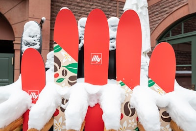 The courtyard experience also featured fun photo ops, including an illy-branded gondola, a fire pit, and custom ski racks—all set in a winter wonderland atmosphere.