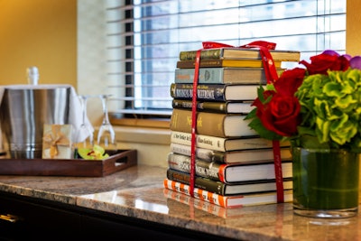Out: fruit baskets. In: book bundles. The Library Hotel's welcome book bundles are an inspiring gift for incoming attendees.