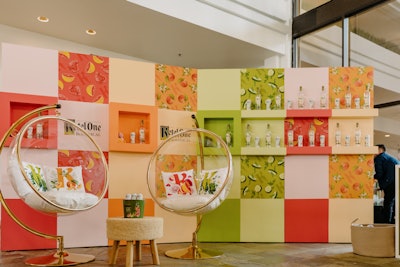 At the Ketel One Botanical activation, the peach and orange blossom, grapefruit and rose, and cucumber and mint varietals were stylishly displayed on a colorblocked wall.