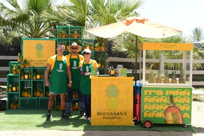 Also during Revolve Festival, Buchanan’s Pineapple served cocktails like the Piña y Coco out of fresh fruit carts, with green shipping crates used as eye-catching shelving to hold fresh pineapples. NVE Experience Agency produced the pop-up.