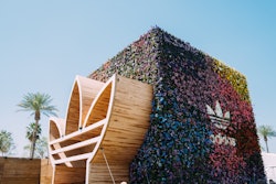 On one side, Bad Bunny’s signature logo made from steel and pine formed a larger-than-life archway entrance. On the other side of the cube was the Adidas logo, which marked a shoppable experience.