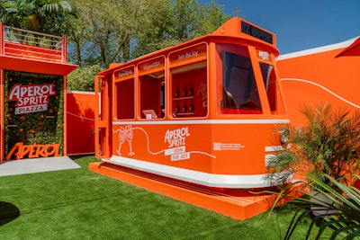 Meanwhile, Aperol Spritz made its first-ever Coachella appearance with the Aperol Spritz Piazza, which opted for an eye-catching orange color scheme. The cheery, photo-friendly space was filled with vibrant flowers and oranges. Swell handled the design, production, and execution of the space, which was intended to be a modern and joyful take on an Italian town piazza.