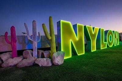 BDG and Event Eleven also opted for an oversize logo for their nighttime NYLON House event, presented by Samsung Galaxy at a private Indio estate. This one leaned into a more futuristic option with neon-lined letters offset by colorful cactuses.