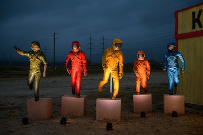 Outside, life-size recreations of the film’s colorful spacesuits greeted guests.