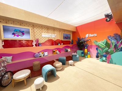 In order to keep the YouTube space dynamic for each artist and influencer who came through, the sets were built to be mobile and customizable, with modular backgrounds and props that could be interchanged to create various vibrant vignettes. There was also a lounge area for creators (pictured).