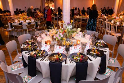 The gathering featured overgrown foliage and tabletop arrangements with pops of color, designed by Putnam & Putnam, to help transport guests to a “fantasy greenhouse,” the theme of the night.