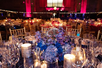 The event design included disco balls hanging from cubed shelving, some of which were fronted by miniature City Harvest trucks. Disco balls also decorated the floral arrangements. Ultimately, the evening raised enough money to provide more than 9.6 million meals for New Yorkers in need.