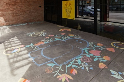 Inspired by scenes from the “End of Youth” song, chalk artists in each city replicated playful chalk elements at the entrance of each pop-up.