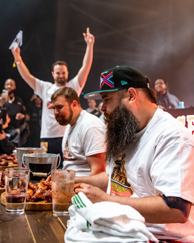 Kelce hosted an on-stage chicken wing eating challenge presented by Wingstop with two local fans competing for bragging rights.