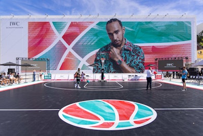 On Wednesday, May 3, Hamilton hosted the IWC Chrono Basketball Challenge alongside Miami-based nonprofit Dibia DREAM. IWC’s three-day takeover transformed the Design District's Jungle Plaza into a Miami Vice-colored basketball court. VIP players included actor James Marsden, former professional football player Antrel Rolle, actor Simu Liu, American Olympic skateboarder Jagger Eaton, and Dibia DREAM founder and CEO Brandon Okpalobi. Public participants booked time slots online to join a professional skills clinic and then competed for prizes, including an exclusive IWC watch.
