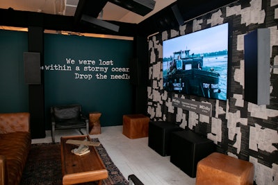 Handwritten lyrics were wheat-pasted onto each wall.