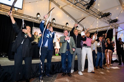 Erick Williams, June Rodil, Aspen Mayor Torre, Devin Padgett, Ray Isle, Bobby Stuckey, Andrew Zimmern, Maneet Chauhan, Carla Hall, and Tom Bair did a group Champagne sabering to kick off the festivities.