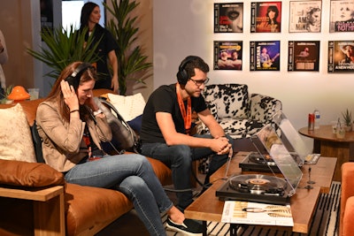 Audible brought its 'Words + Music' series to life at SXSW with a lounge that featured a photo-worthy wall showcasing the covers of all 35 volumes in the series. A corner of the space allowed attendees to sample each record via a record player and headphones.