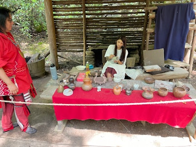 At the Oconaluftee Indian Village, contemporary members of the Eastern Band of Cherokee Indians demonstrate traditional arts like pottery.