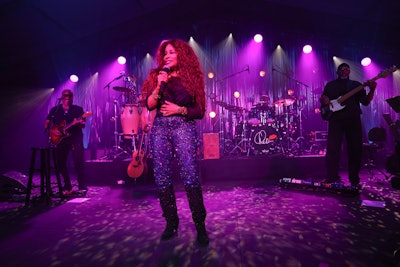 Chicago native Chaka Khan headlined a live concert, produced by Frost, after dinner. HMR Designs created a reflective, liquid-silver backdrop for the stage. Frost handled the multicolored lighting.