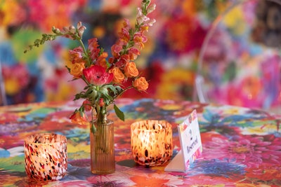 Bright, summery flower arrangements decked the tables.