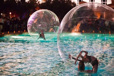 LA-based entertainment company Zen Arts offers an array of water-based performance options, including these 'bubble spheres.' The performers are trained dancers, acrobats, and contortionists, performing from inside giant floating bubbles inside a pool or other water feature. Zen Arts also can book synchronized swimmers or 'mermaids' for pool-based events.