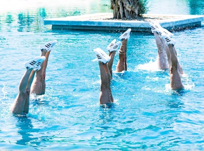Synchronized swimmers have long been a popular way to add some entertainment to a pool-centric event—so why not turn it into a subtle branding moment? At Coachella in 2019, Adidas' annual Sports Club featured synchronized swimmers wearing the brand's iconic black-and-white sneakers. Taking it a step further, the event also had the Adidas logo floating in the water; water jetpack acrobatics entertained guests and served as an eye-catching photo op. The Corso Agency handled production for the Sports Club. See more: Coachella 2019: 6 Design Trends to Steal for Your Next Event