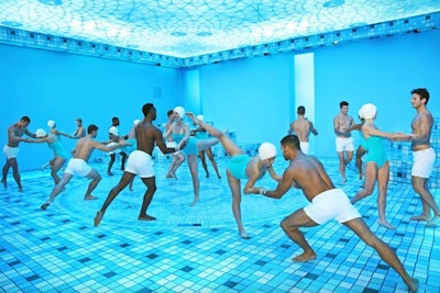 Sure, these may look like synchronized swimmers... but there isn’t actually any water! When Hermès opened its Beverly Hills flagship store, one room was an interpretation of a glamorous vintage pool—with a giant LED ceiling creating an underwater effect, a troupe of dancers meant to evoke synchronized swimmers, and a faux tile floor bearing the house's H motif.