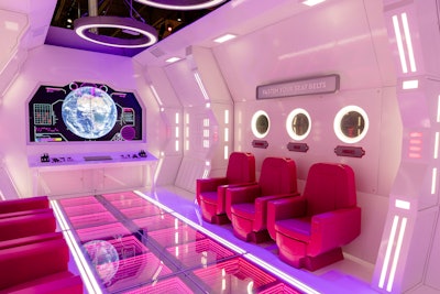 The Barbie Interstellar Airways installation featured a space shuttle complete with pink seats and a control board where visitors could track objects on radar and report back to mission control.