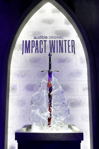In addition to The Feast—which included photo ops like a sword in a block of ice—Audible also partnered with Skybound on an interactive listening booth at the convention. Fans could snap photos in a 360-degree themed photo booth and participate in individual listening sessions of highlights from season one of Impact Winter, along with previews of season two.
