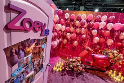 Inside the experience, consumers could find the Zoey 102 door with a collage of photos from Zoey 101, and be given their own key mimicking Zoey’s key necklace from the original series. The key granted them access to the ultra-Instagrammable room filled with pink balloons, a wedding guest book to sign, and Zoey’s pink Vespa with wedding cans on the back.