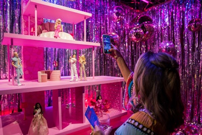 'We created a replica of the Barbie Dreamhouse set with vignettes featuring the 'Barbie The Movie' doll collection, her iconic Corvette, and two custom Barbie disco ball logos,' Lefkovitch said.