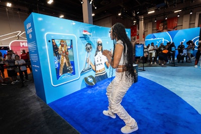 Other experiences included this AR apparel station where fans got a chance to dress like Wilson (pictured) and Dallas Wings player Arike Ogunbowale. They could view their images at one of the AR mirrors on site or on their phone through a filter.